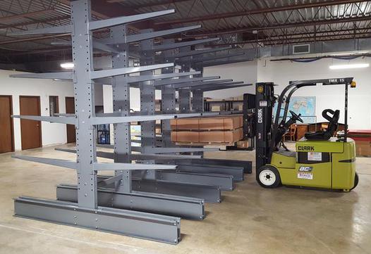 Fork life adding pallets to series 4000 Meco Omaha Heavy Duty Cantilever Racking