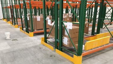 Post protector wraps in use on pallet rack in warehouse